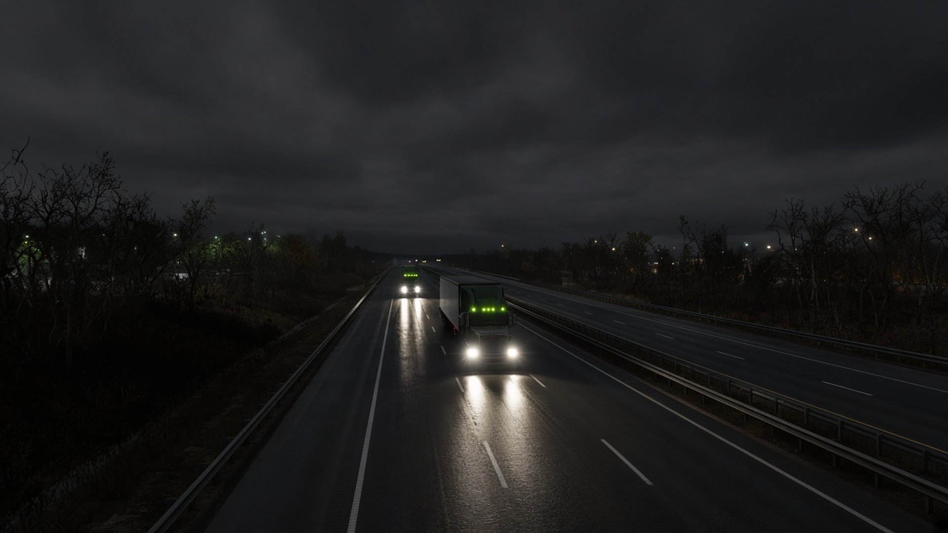 Night interstate with long-haul trucks moving between freight terminals